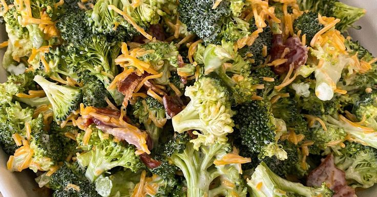 broccoli florets and pine nuts are mixed together