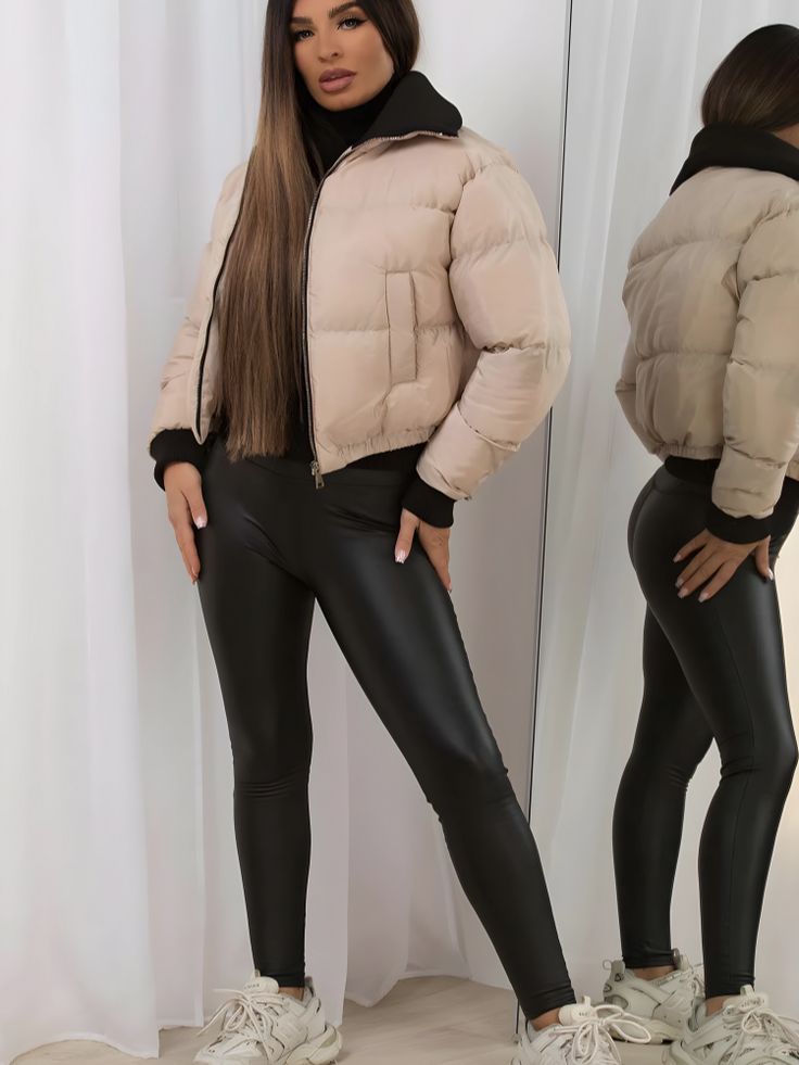 Elevate your winter wardrobe with the trendy and cozy Cropped Puffer Jacket with Rib Collar in elegant beige. This stylish piece combines fashion-forward design with practical warmth, making it a must-have for the colder months. The standout feature of this jacket is its cropped silhouette, which adds a modern twist to the classic puffer style. The shorter length makes it perfect for layering over your favorite high-waisted jeans or dresses, adding a touch of contemporary flair to any outfit. Crafted from high-quality materials, including a durable outer shell and insulating filling, this puffer jacket is designed to keep you warm and comfortable in chilly weather. The ribbed collar provides extra protection against the cold, while adding a stylish contrast to the overall design. The front Khaki Long Sleeve Winter Puffer Jacket, Beige Puffer Jacket With Padded Collar, Beige Long-sleeved Puffer Jacket With Padded Collar, Chic Cream Winter Outerwear, Cream Long Sleeve Puffer Jacket With Padded Collar, Trendy Winter Puffer Jacket For Cold Weather, Trendy Winter Puffer Jacket, Chic Winter Outerwear For Cold Weather, Hooded Beige Puffer Outerwear