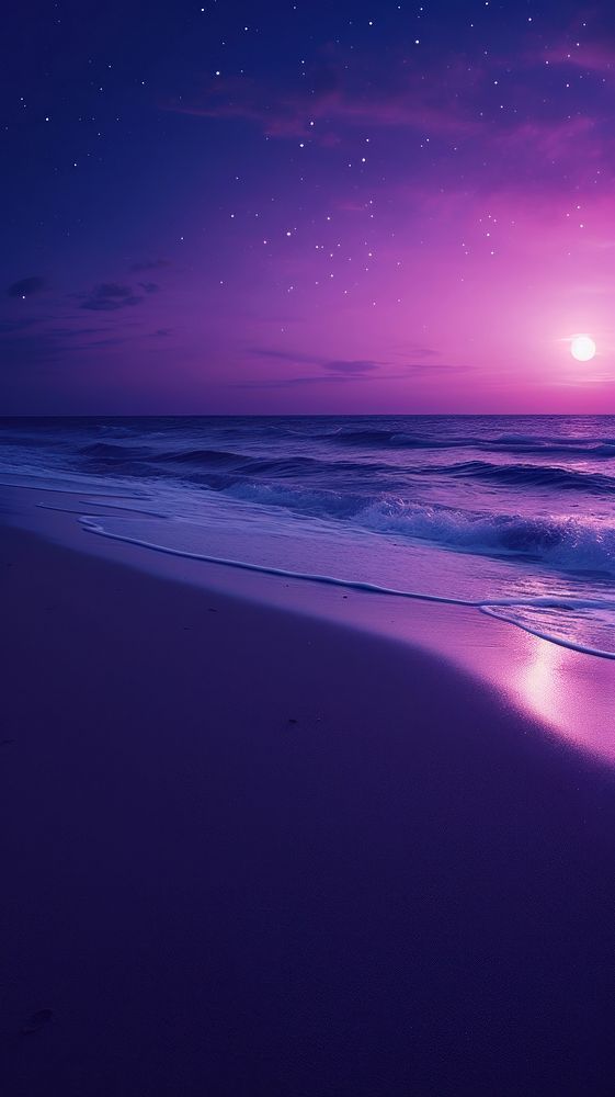 a purple sky with stars and the ocean