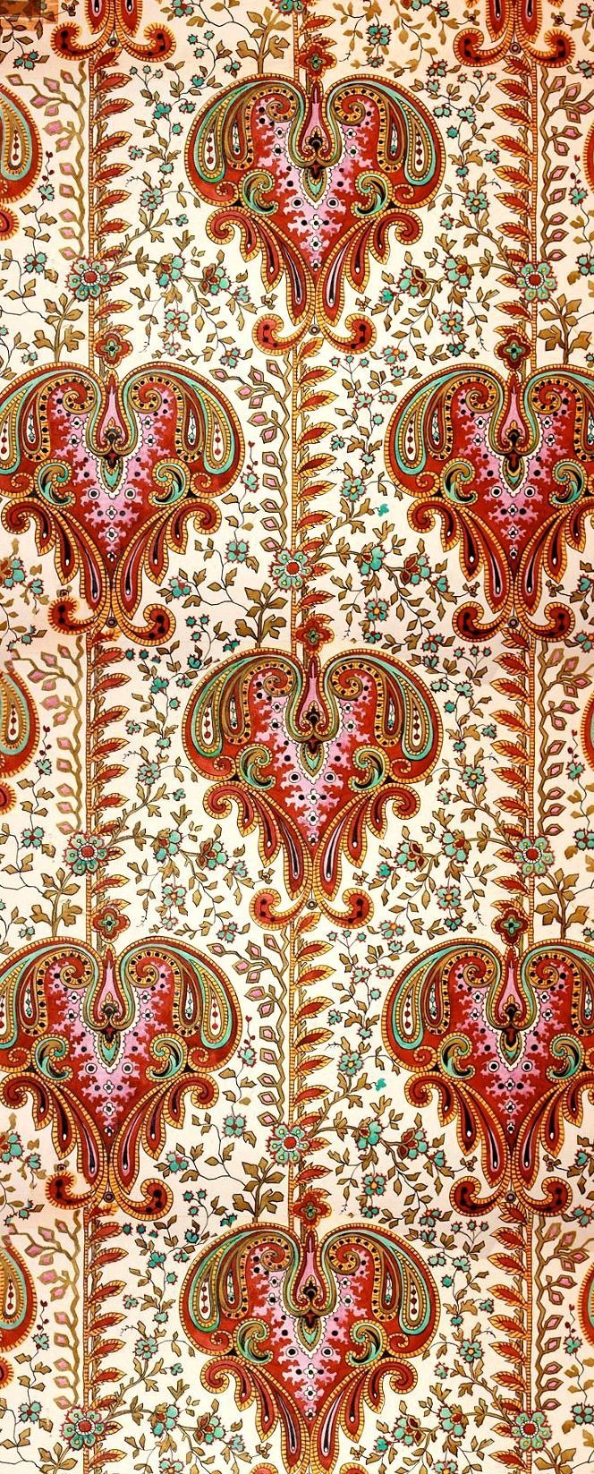 an intricately designed fabric with red and green colors