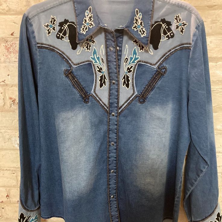 Tasha Polizzi New Devon Shirt, Indigo Color, Variations In The Color Are Intentional To Add Color And Texture For The Unique Beauty Of This Garment, Long Sleeve With Snaps, Snap Front Closure, Tp Vintage Washed Denim Embroidered Western Tops For Summer, Western Style Embroidered Summer Tops, Blue Traditional Shirt For Spring, Western Style Blue Tops For Spring, Traditional Blue Shirt For Spring, Blue Embroidered Relaxed Fit Blouse, Western Blue Button-up Top, Blue Bohemian Button-up Shirt, Blue Bohemian Button-up Top