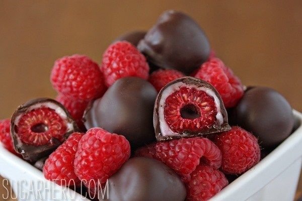 chocolate covered raspberries in a white bowl