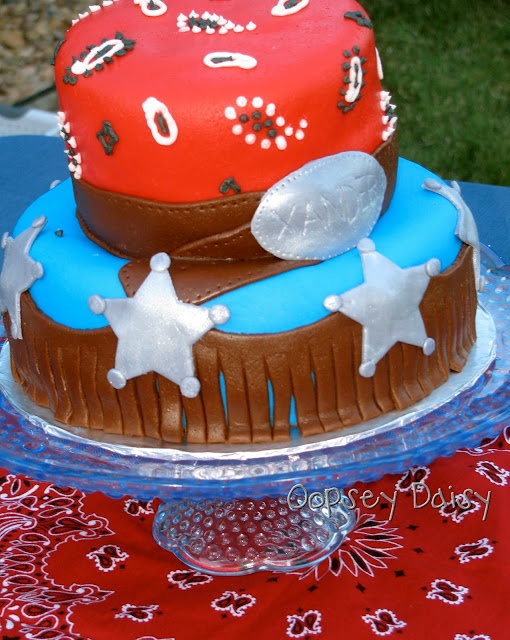 a red and blue cake sitting on top of a table