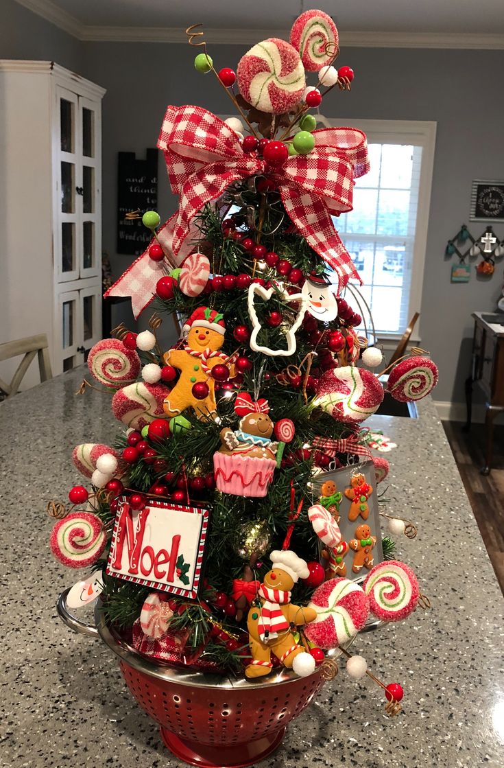 a christmas tree decorated with candy canes and candies