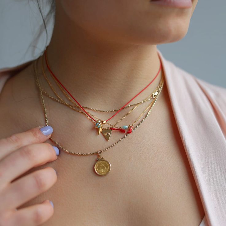 Introducing our Evil Eye Tassel Necklace, a top-seller from Sunday Forever. This must-have piece features an evil eye and small red tassel, available in either sterling silver or 14k gold filled. Wear it alone for a delicate touch or pair it with other necklaces for a layered look. It also makes for a thoughtful gift, packaged in our signature snap case and drawstring Nice Things pouch, complete with a description card. Plus, the chain can be easily adjusted from 15" to 17.5" for the perfect fit Good Luck Charm Necklace With Delicate Chain, Gift Lariat Charm Necklaces, Charm Necklace Diy, Gold Tassel Necklace, Cotton Pouch, Beads Bracelet Design, Dope Jewelry, Custom Charms, Jewelry Outfit