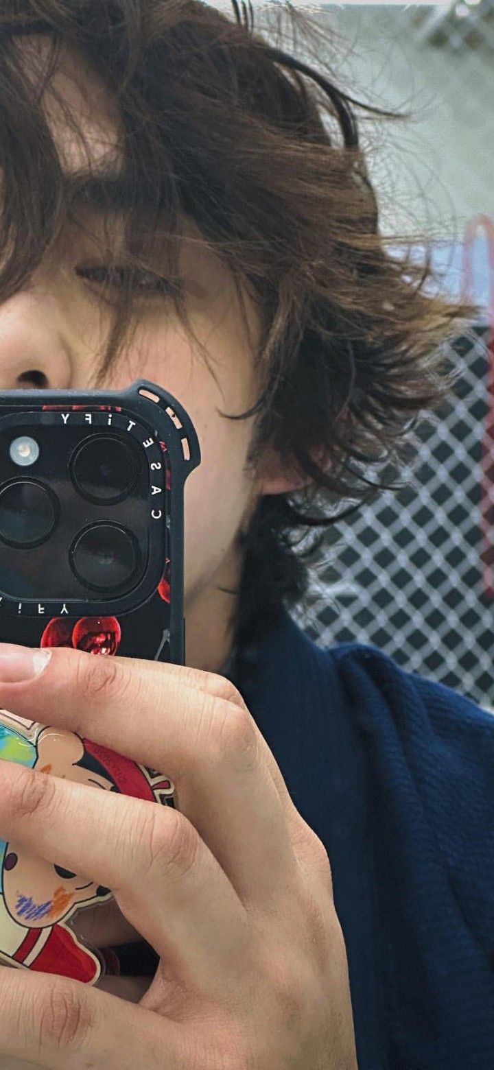 a woman taking a photo with her cell phone