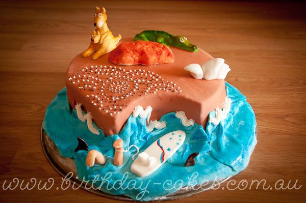 a birthday cake decorated to look like a beach scene