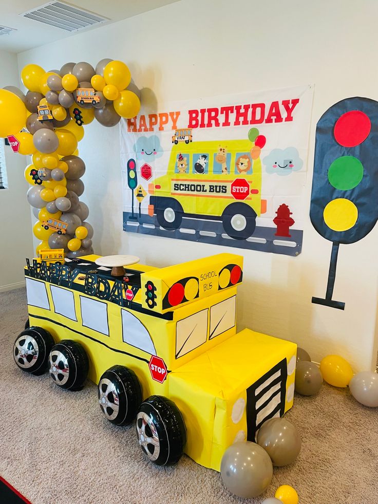 a school bus birthday party with balloons and streamers