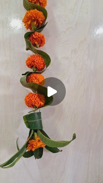 an arrangement of orange flowers arranged in a row