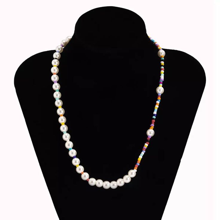 DESCRIPTION "Necklace with beads made of clay with rhinestone appliqués, multicolored beads, and faux pearls. This necklace will add a unique touch to all your looks. Wear this stunning piece solo or layered." FEATURES Synthetic pearls with multicolored beads Handmade item Weight: 12 g/ 0.42 oz 100% unisex Multicolor Bohemian Pearl Necklace With Colorful Beads, Colorful Multi-strand Pearl Beaded Necklaces, Adjustable Multi-strand Pearl Beaded Necklace, Spiritual Multi-strand Necklace With Polished Beads, Multicolor Polished Pearl Bead Necklace, Korean Jewelry, Pearl Choker, Choker, Colorful Boho