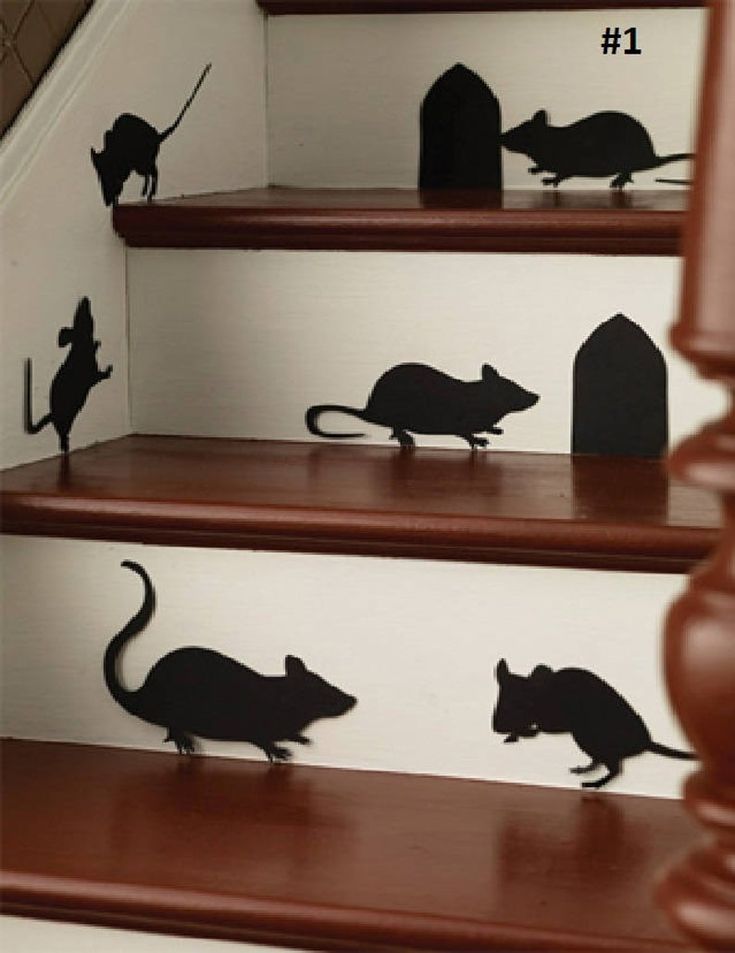 the silhouettes of mice are on the stairs in this house's stairwell area