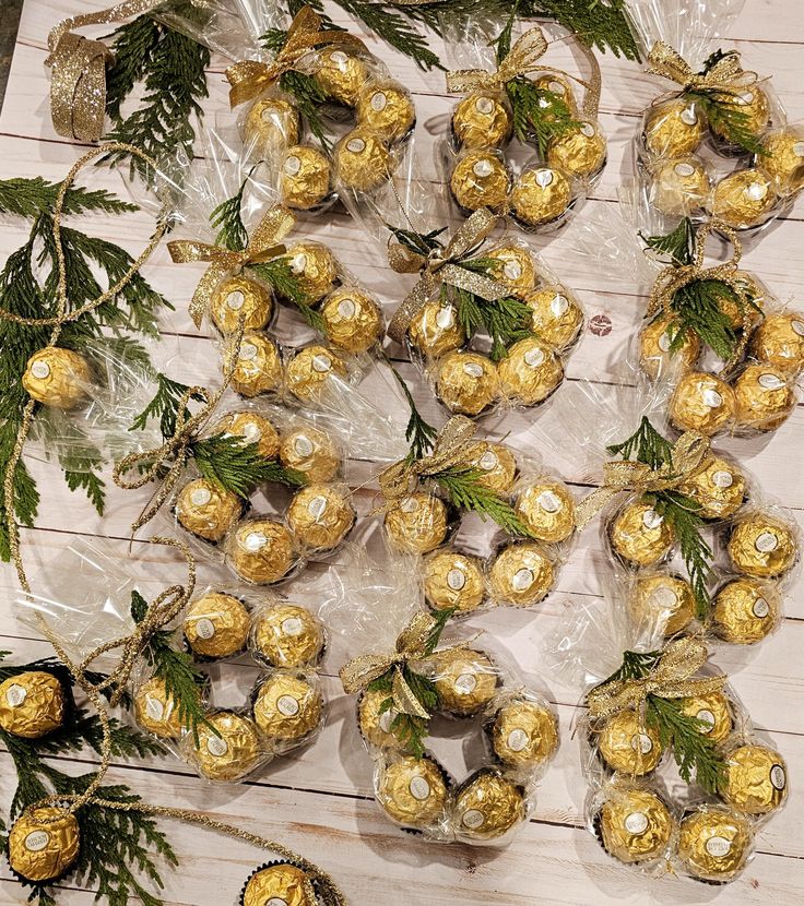 chocolates wrapped in cellophane and tied with twine on top of a wooden table