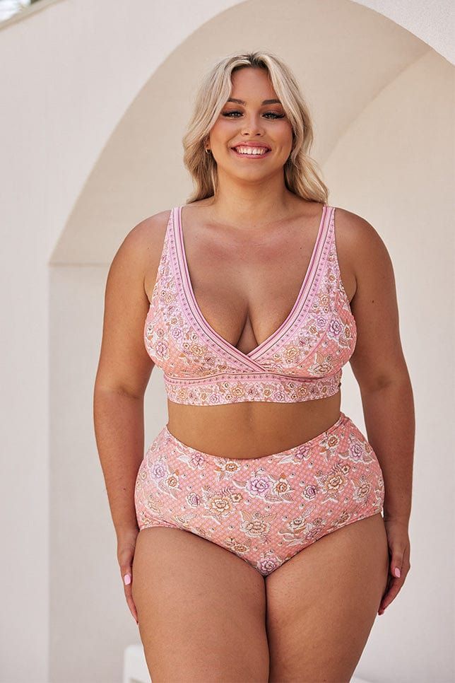 Seychelles Pink Plus Size Bikini Top with V Neck Discover the cutest bikini top of the summer. The Seychelles V Neck Bikini Top is designed to offer a supportive and flattering look with adjustable straps and a multifit bust. The classic V neckline lets you show a little cleavage, while the longer line offers extra coverage for your midsection. The coordinating Seychelles High Cut Pant looks great paired with this top, giving you confidence and comfort at the beach or pool. Shelf Bra V Neckline Adjustable Straps Multifit B-E Cup Studio Model Wears Size 16 Fabric: 82% Nylon 18% Spandex Beach Low-cut Bra With Adjustable Straps, Adjustable Low-cut Bra For Beach, Low-cut Bra With Adjustable Straps For Beach, Vacation Swimwear, Bra Friendly Low-cut, Vacation Swimwear, Bra Friendly And Low-cut, Low-cut Vacation Swimwear Bra Friendly, Beachwear Tankini With Padded Cups, Bra Friendly Low-cut Swimwear For Vacation, Seamless V-neck Beach Bra