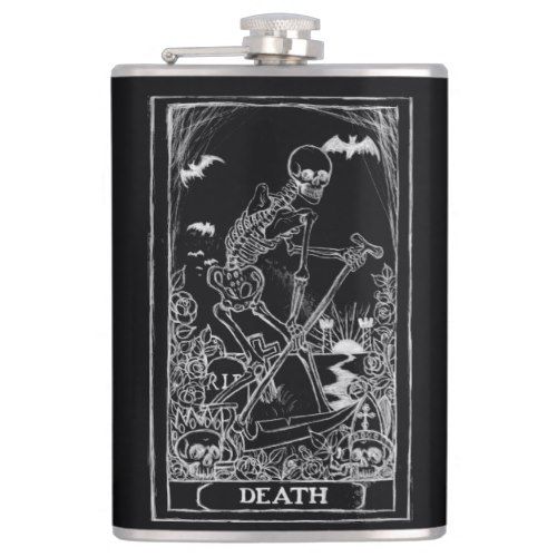 a black flask with a skeleton on it