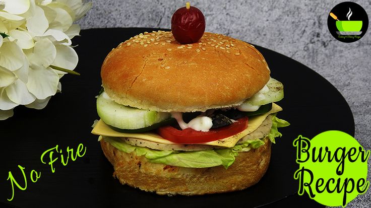 there is a burger with lettuce and tomatoes on it