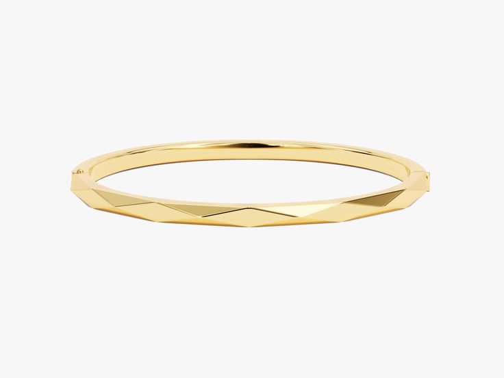 Crafted from the finest 14k gold, this bangle showcases a sleek, avant-garde geometric design. The clean lines and bold shapes make a powerful statement, turning your wrist into a canvas of modern sophistication. Wear it solo for a minimalist yet impactful look, or stack it with other bracelets to curate your unique style narrative.Features• Made to Order• Gold Kt: 14K• Gold Colors: Rose Gold, Yellow Gold, White Gold• Width: 3.70 mm• Thickness: 3.00 mm Modern Round Gold Bracelet For Formal Occasions, Modern Round Gold Bracelet With Polished Finish, Modern Gold Bangle For Formal Occasions, Modern Polished Gold Round Bracelet, Modern Gold Formal Bangle, Modern Yellow Gold Bracelet With Shiny Finish, Modern Yellow Gold Cuff Bracelet With Shiny Finish, Modern Shiny Yellow Gold Cuff Bracelet, Modern Gold Bracelet With Polished Finish