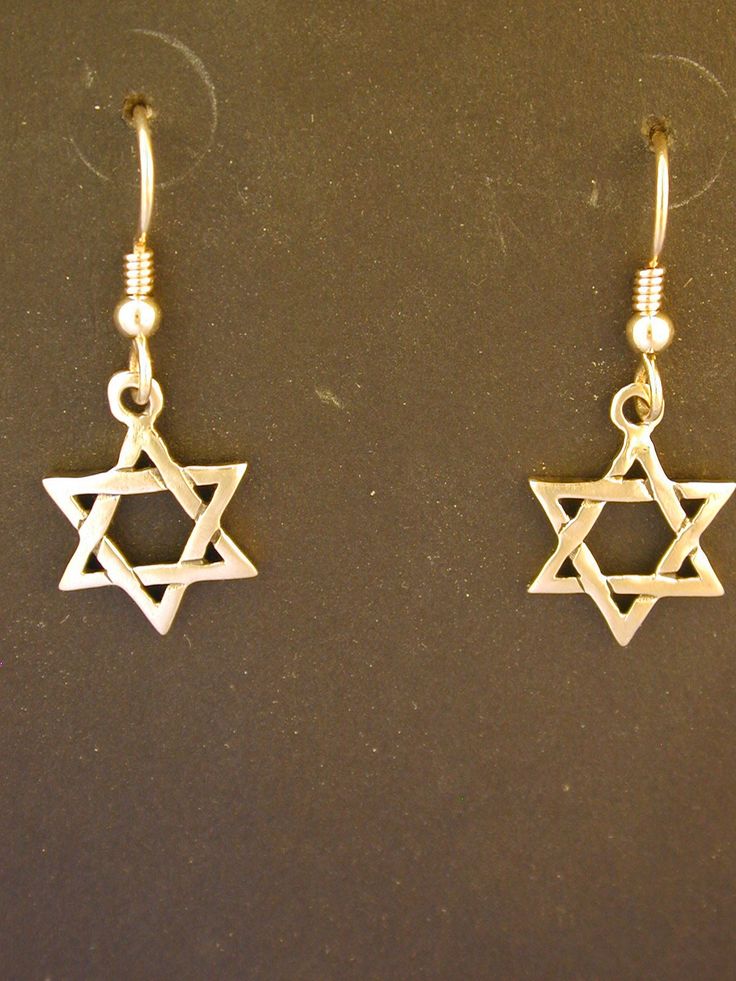 "This Star of David pendant is 14K Gold. The Heavy French Wires are 14K Gold. This Star of David measures 5/8' across and 5/8\" tall. I hand cast all my pieces using the lost wax casting method. Please ask your needs. You may call me with questions, often I am out so please use my machine. 831-476-3176. Satisfaction Guaranteed! This piece is made and ready to ship I send items USPS First Class unless otherwise directed. I send as soon as I can, usually in one to five days. I do shows and am out Symbolic Nickel-free Star Earrings, Symbolic Star-shaped Nickel-free Earrings, Nickel-free Star Shaped Symbolic Earrings, Silver Star Of David Pendant In 14k Gold, Silver Star Of David Jewelry In 14k Gold, Silver Star Of David 14k Gold Jewelry, Gold Sterling Silver Earrings With Star Charm, 14k Gold Star Shaped Pierced Jewelry, Gold Earrings With Star Charm