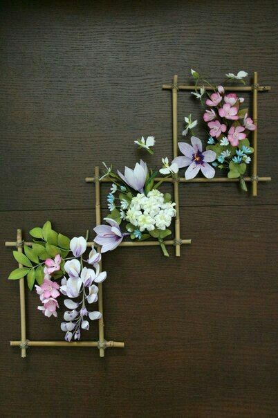 three wooden frames with flowers on them