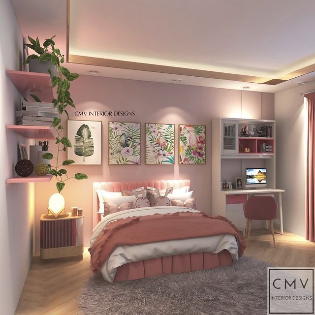 the bedroom is decorated in pink and white with pictures on the wall above the bed