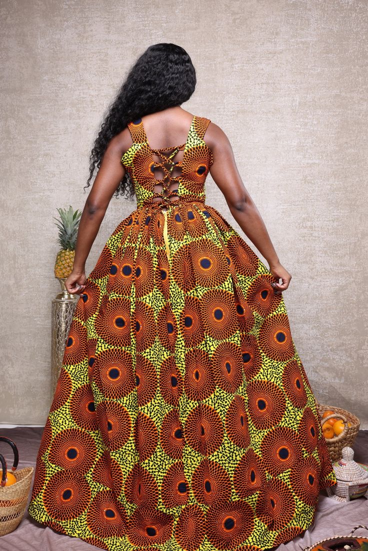 Our Elegant African Print Maxi or Ball gown. This beauty can be altered and customized to suit your preferred style. The maxi dress is handmade to order and with your right measurements you’ll get the perfect fit. This beautiful long African print maxi dress is made for all events. I have size Medium, large and Xlarge in stock, other size are made to order. Round neck with corset back as seen in the picture. .Material 100% African print cotton. .sleeveless with pockets on both sides. .Perfect su Corset African Dress, Long Ankara Dress Styles Gowns, Long Ankara Dress Styles, Long Maxi Dress Outfits, Ankara Dress Styles For Church, Long Ankara Dresses, African Print Maxi Dress, Kitenge Designs, Ankara Long Gown