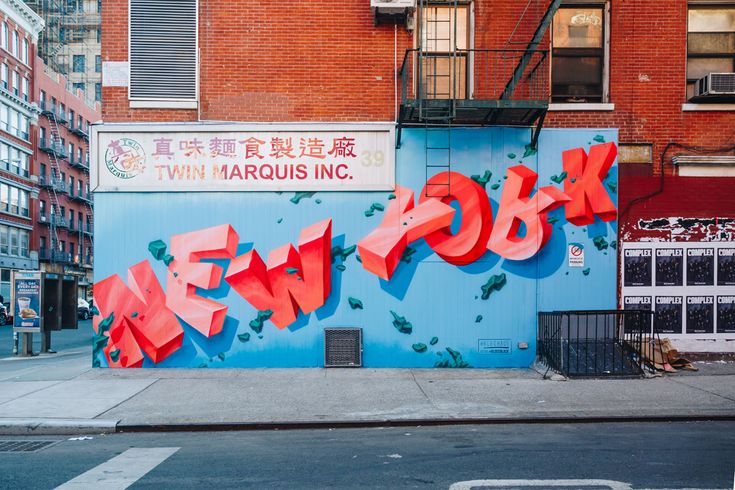 the word new york painted on the side of a building