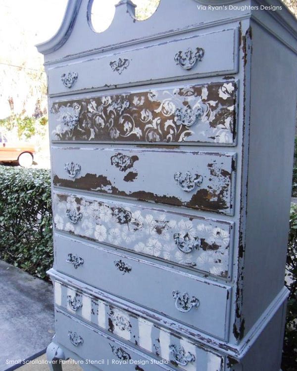 an old dresser is painted blue and white