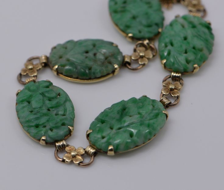 "This is a 14K YG Antique Carved Jadeite bracelet with 5 pierced and floral carved placques with gold flowers bewtween each circa 1930; 10/16\" width of Cabochon, weight 19.2 grams, Bracelet 6\" length with guard chain Stock # BB79A02" Boston Ma, Blue Topaz Ring, Topaz Ring, Gold Flowers, Pink Tourmaline, Chain Link Bracelet, Link Bracelets, Blue Topaz, Chain Link