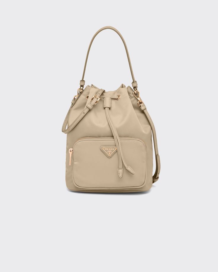 Desert Beige Prada Duet Re-Nylon bucket bag | PRADA Soft Contemporary, Prada Tote Bag, Bag Prada, Designer Tote Bags, Designer Totes, Prada Bags, Triangle Logo, Women Leather, Tote Bag Design