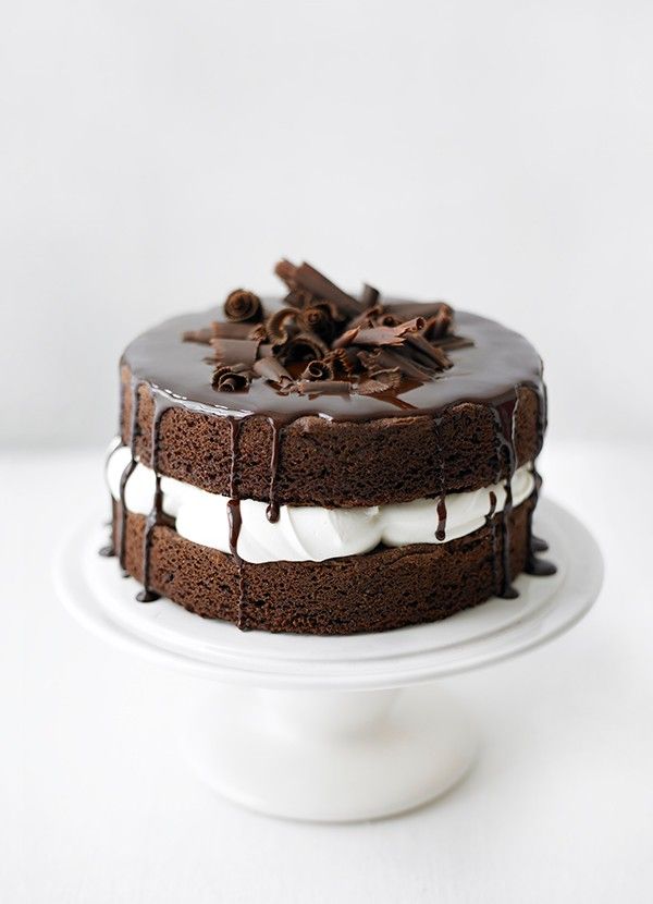 a cake with chocolate icing and white frosting