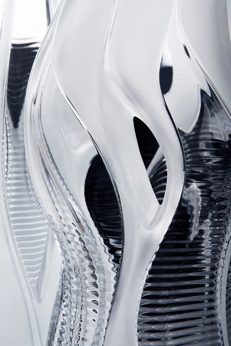 a close up view of a glass vase with wavy lines on the bottom and sides