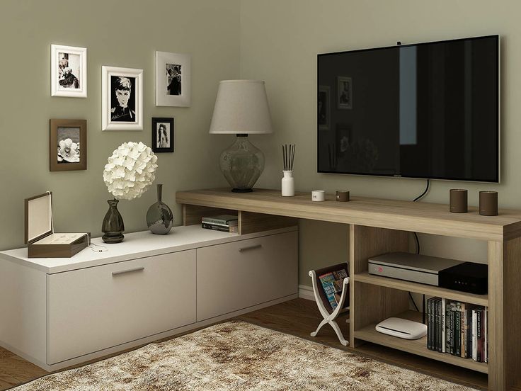 a flat screen tv sitting on top of a wooden entertainment center