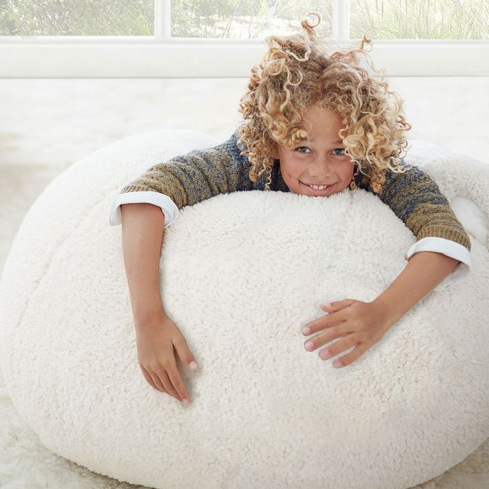 A plush slipcover makes this beanbag the softest seat in the house. Our superior-quality faux fur is as indulgent as it is beautiful. It's exceptionally woven from the finest materials for a sumptuously plush feel and beautifully emulates the inherent softness of genuine fur. GREENGUARD Gold Certified. This low-emitting product has been screened for over 10,000 chemicals and VOCs to contribute to cleaner indoor air and keep you and your family safer. Made in a Fair Trade Certified(TM) factory, s Linen Blackout Curtains, Emily And Meritt, Bean Bag Chair Covers, New Mickey Mouse, Bag Chair, Faux Fur Fabric, Fur Fabrics, Pottery Barn Teen, Slipcovers For Chairs