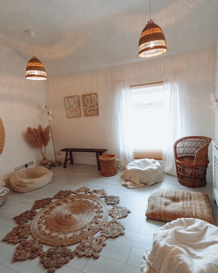 a living room filled with lots of furniture and decor on top of white tile flooring