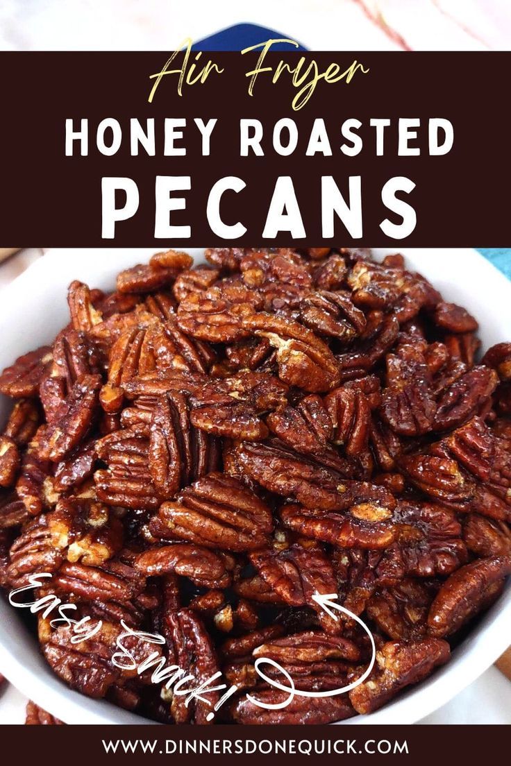 a white bowl filled with honey roasted pecans