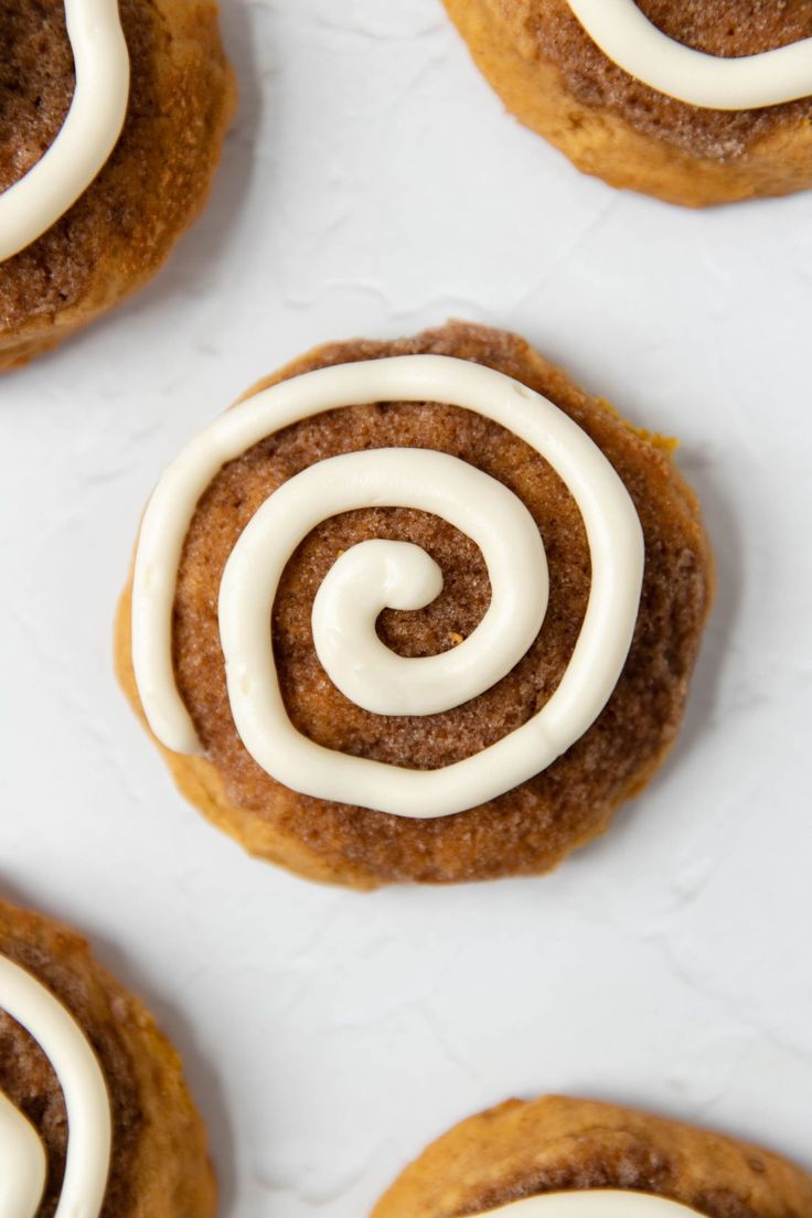 cinnamon roll cookies with white icing on top