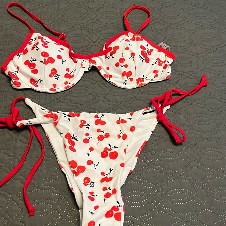 Adorable Cherry Print With A Red Piped Bikini. Top Is Underwire With Adjustable Straps. Bottom Is Triangle With Tie Side Top And Bottom Are Fully Lined Attack. Red Cherry Print Swimwear For Spring, Fitted Cherry Print Swimwear For Beach, Spring Beachwear Swimwear With Cherry Print, Cherry Print Swimwear For Beach Season, Cherry Print Swimwear For Vacation Beach Season, Red Cherry Print Swimwear For Summer, Summer Cherry Print Swimwear For Vacation, Cherry Print Swimwear For Pool, Cherry Print Swimwear For Beachwear At Pool