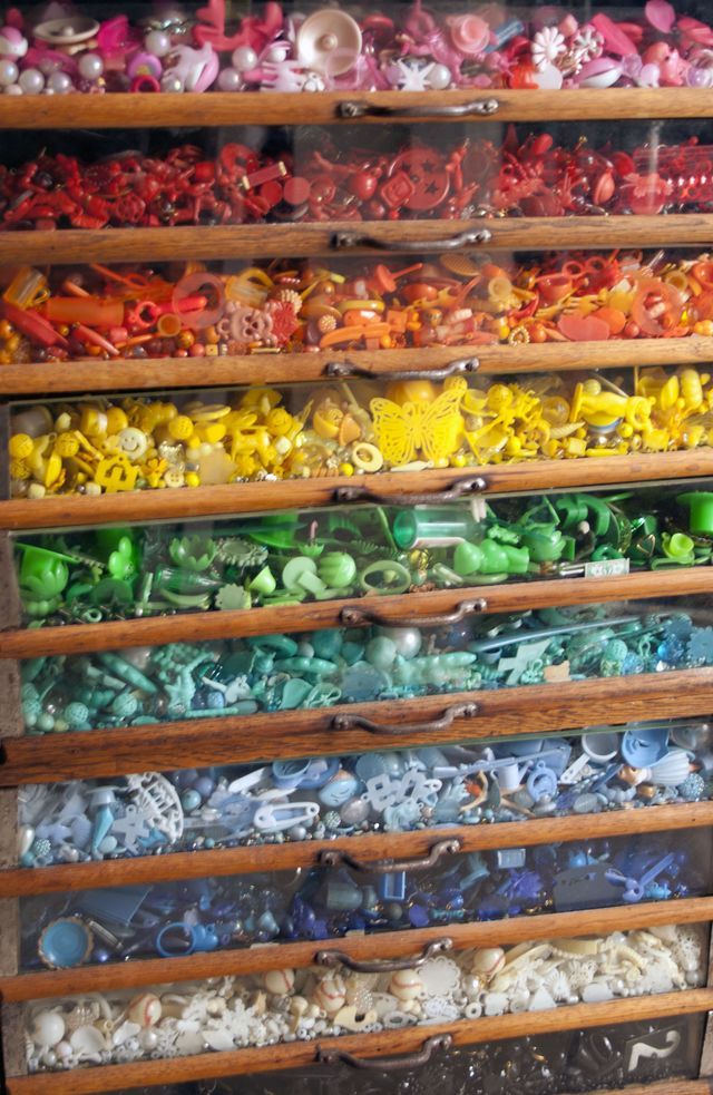 a display case filled with lots of different colored toys