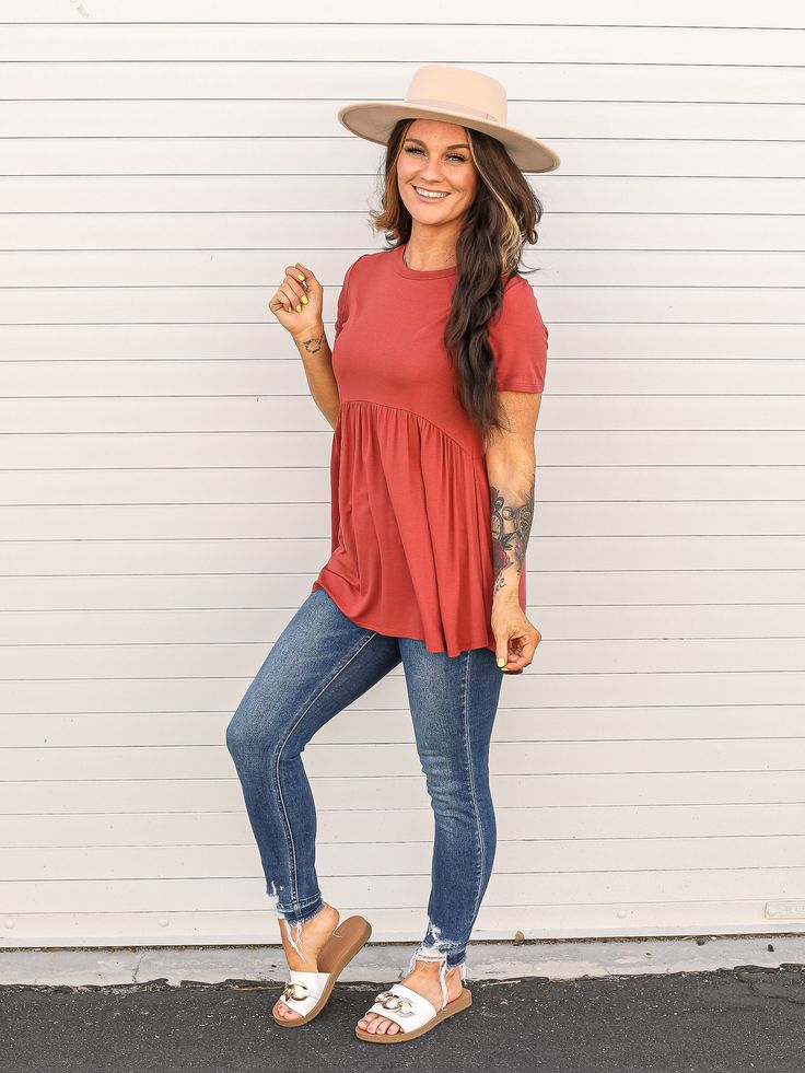 Light brick colored short sleeve babydoll top. Casual Solid Flowy Blouse, Casual Solid Color Flowy Blouse, Flowy Casual Blouse, Flowy Solid Color Casual Blouse, Flowy Short Sleeve Tops For Loungewear, Rayon Short Sleeve Tops For Loungewear, Flowy Casual Rayon Tops, Casual Flowy Tops For Day Out, Flowy Casual Tops For Day Out