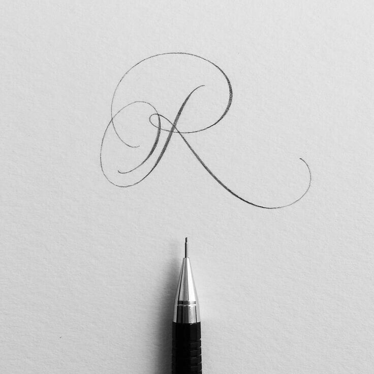 the letter k is drawn with a fountain pen