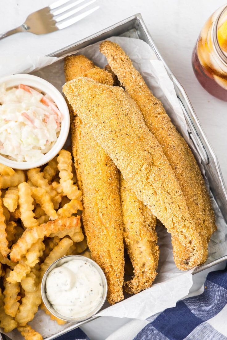 fish sticks, fries and dip in a tin container