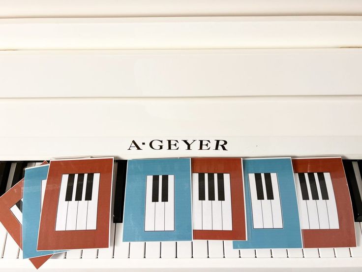 an arrangement of piano keys with the name agyer on it's side