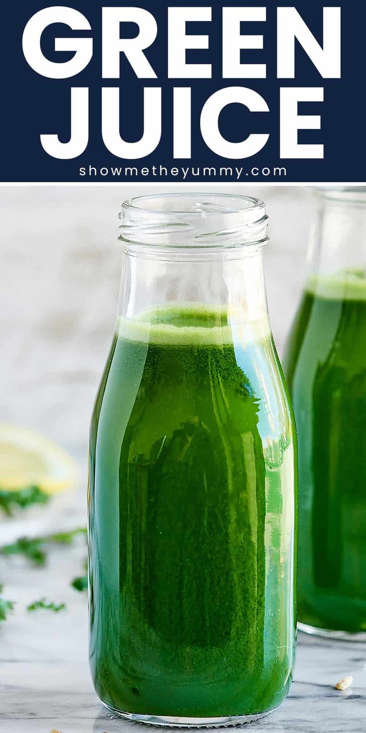 two jars filled with green juice on top of a table