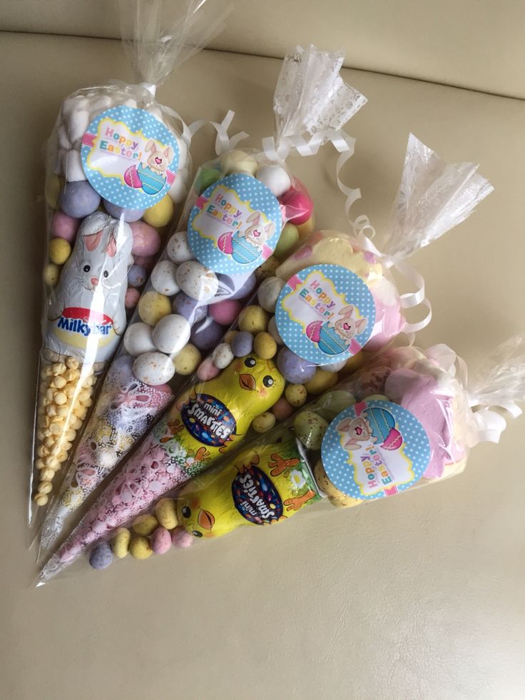 several candy cones and candies in plastic bags