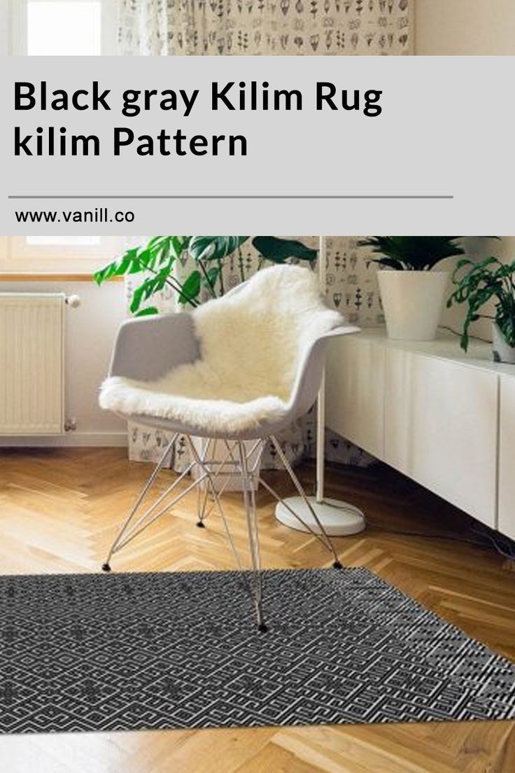 black gray klim rug with white chair and potted plant in the corner next to it