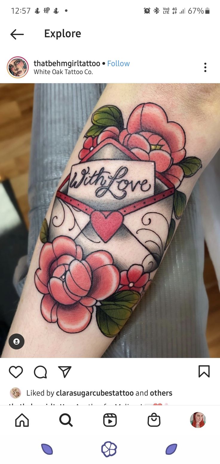 an arm tattoo with roses on it and the word love is written in black ink