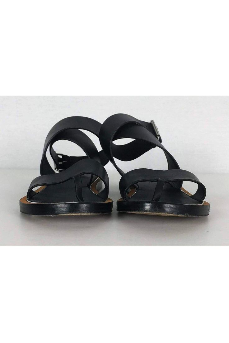 Chic sandals in black leather with an ankle strap design. Perfect for casual wear, style them with any dress or skirt. Size 6 - EU 36 Leather upper & sole Ankle strap design Silver-tone buckle Tan brown & silver trim Some wear on sole Light marks on leather Light creasing on leather Outsole length 9.5" Black T-strap Sandals With Buckle Closure For Spring, Black Sandals With Buckle Closure For Vacation, Black Footbed Sandals With Buckle Closure For Spring, Black Buckle Closure Footbed Sandals For Spring, Black Spring Footbed Sandals With Buckle, Black Strap Slingback Sandals For Summer, Summer Black Slingback Sandals With Strap, Black Buckle Closure Sandals For Spring, Black Footbed Sandals With Buckle And Flat Heel