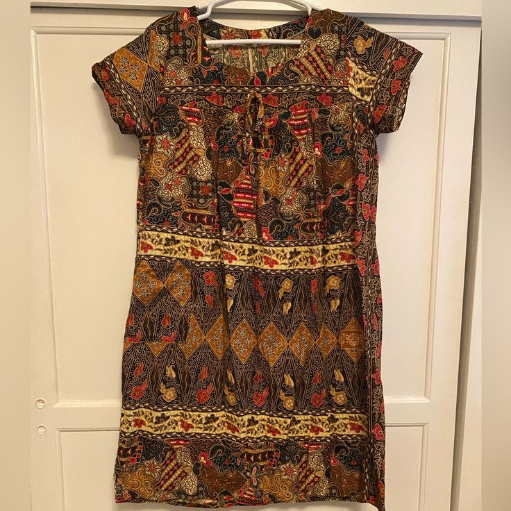 Autumn Colored, Batik House Dress, Like New, Never Worn. Possibly Handmade, It Was A Gift. No Size But Would Fit Anywhere From A Small To Large. Patterned Batik Print Short Sleeve Dress, Patterned Batik Print Dress With Short Sleeves, Patterned Short Sleeve Dress With Batik Print, Red Short Sleeve Dress With Batik Print, Casual Batik Print Tunic Dress, Casual Brown Batik Print Dress, Casual Brown Dress With Batik Print, House Dress, Fall Colors