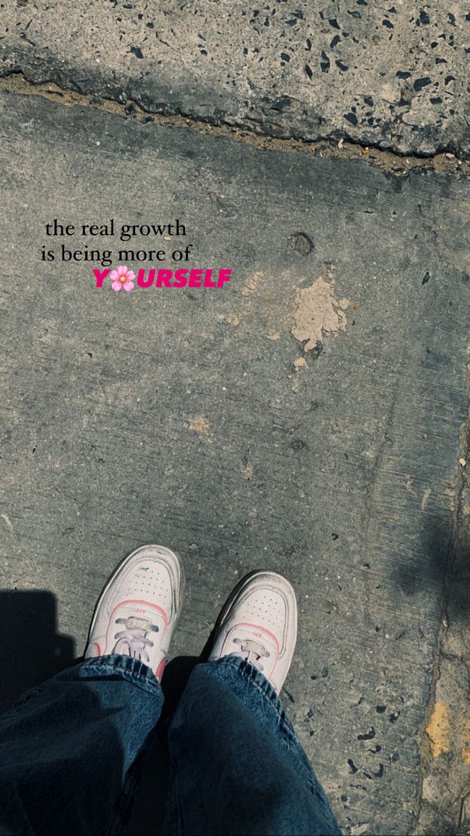 someone is standing on the sidewalk with their feet up and there is a pink sticker that says, the real growth is being more of yourself