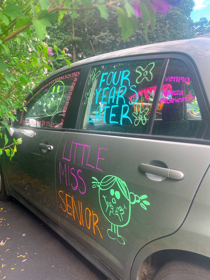 a car with writing on the window and in front of it that says four year later, little miss senior