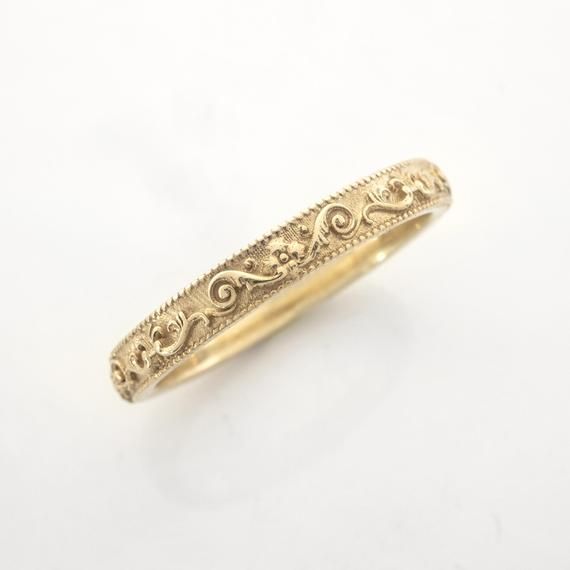 This vintage-inspired ring is inspired by the Italian Baroque style.Handmade and polished, it is available 8K or 14K gold and has a uniquely vintage vibe about it. This ring is designed in 3D and not made out of wire or soldered but cast directly in your size so there are no solder marks on the ring whatsoever. Customization:This band is fully customizable with any text you would like on the inside, at no extra cost. It can also be made in any size, too! Please message me for quarter sizes. Mate Yellow Gold Bands With Intricate Design, Classic Yellow Gold Band With Intricate Design, Yellow Gold Bands With Intricate Design In 14k, 14k Yellow Gold Bands With Intricate Design, Intricate Design 14k Yellow Gold Bands, Elegant Ceremonial Rings With Intricate Design, Ceremonial Elegant Rings With Intricate Design, Heirloom Round Band With Intricate Design, Ceremonial Rings With Intricate Design